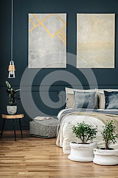 Navy blue bedroom with art