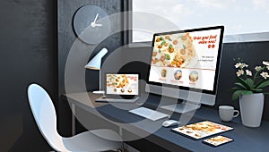 Navy blue workspace with responsive devices order food responsive design website