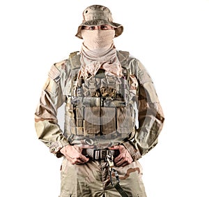 Navy seal specialist in combat gear with his hands on his belt posing in front of camera