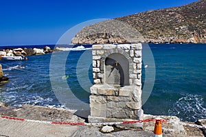 Naxos, Greek Island, Greece, 08 21 2021: Water on tap on the roadside of the bay.