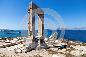 Naxos island, Temple of Apollo on islet of Palatia, Cyclades Greece. Sea, harbor, sky background