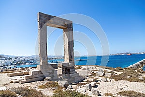 Naxos island, Temple of Apollo on islet of Palatia, Cyclades Greece. Sea, harbor, sky background