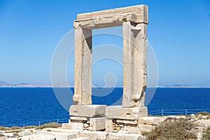 Naxos Portara, Temple of Apollo, Cyclades island, Greece. Sunny day, calm sea, blue sky background