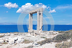 Naxos Portara, Temple of Apollo, Cyclades island, Greece. Sunny day, calm sea, blue sky background