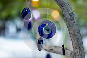 nazar, amulets, talismans against the evil eye on a tree photo