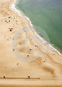 Nazare, Portugal - July 19, 2019 : Aerial view of the beach from the Miradouro do Nazare photo