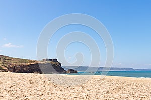 Nazare, Portugal - June 29, 2021: View of the fortification and lighthouse of Nazare from the North Beach