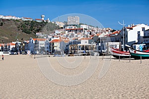 Nazare, Portugal - November 5, 2017: colorful traditional old wooden fishing boat on the beach of fishing village of Nazare .