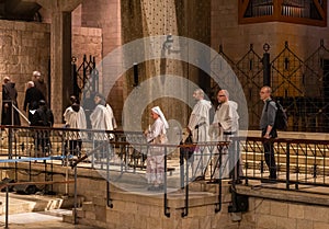 Monks after finishing the prayer enter the main altar of Church of the Annunciation in the Nazareth city in northern Israel