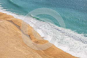 NazarÃ© beach showing beach and ocean in NazarÃ©, Portugal photo