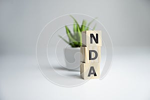 NDA Non-Disclosure Agreement text on wooden cubes