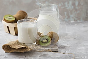 Diet concept with the kefir yogurt on a concrete background