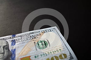 ne hundred dollar bill on black background