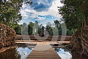 Neak Poan is an artificial island with a Buddhist temple on a circular island in Cambodia photo
