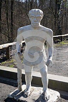 Neanderthal man sculpture made according to old ideas on the Art Trail at the Neanderthal Museum Mettmann near Dusseldorf, Germany