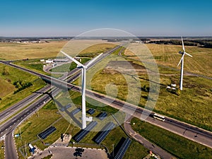 Near huge wind stations background blue sky and top