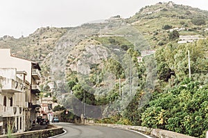 Near road and hills with trees