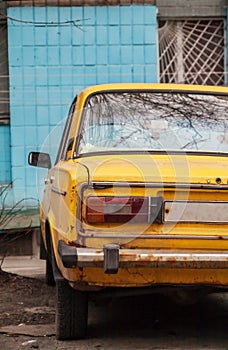 Near the wall is a blue yellow old Soviet machine, Kiev, Ukraine