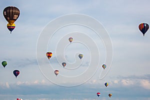 Near Wausau, Wisconsin, USA, July 10, 2021, Taste N Glow Balloon Fest. Hot air balloons fill the sky in central Wisconsin