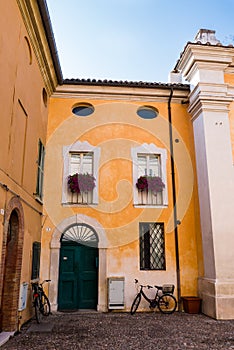 Nearby colorful house Chiesa dei Santi Giovanni e Paolo, in Ravenna
