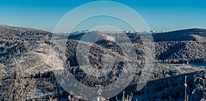 Nearer hills of Beskid mountains and Tatra mountain on the background during winter day with clear sky