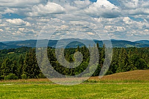 Nearer hills of Jablunkovske medzihorie and Moravskoslezske Beskydy mountains from meadow bellow Lieskova hill summit in Kysucke