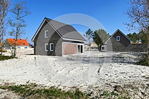 Nearly finished new homes being built on a construction site