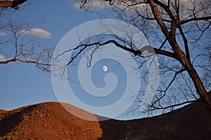 Nearly full moon over a hill near Thermopolis