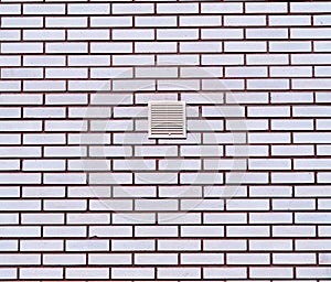 Neat brick wall with centered ventilation architecture background