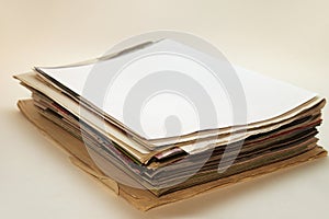 Neat little stack of newspapers and magazines. shallow depth of field