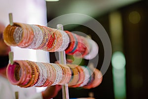 Neat orderly rack filled with an array of vibrant colored threads, neatly arranged in stacked rows