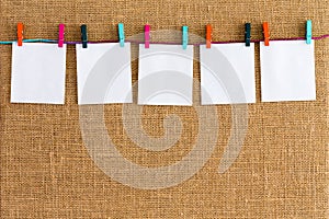 Neat row of hanging blank white notepads