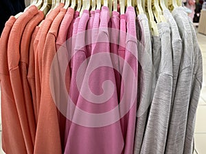 Neat rows of t-shirts with hangers