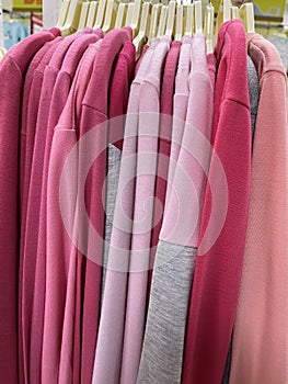 Neat rows of t-shirts with hangers