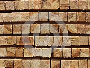 Neat softwood beam in stacks of texture for the background photo