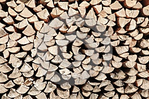 Neat stack of cut wood, textured background