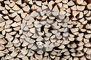 Neat stack of cut wood, textured background