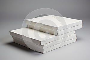 Stack of blank white pizza boxes on neutral background