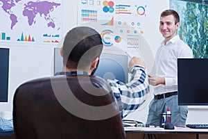 A neat and stylish office worker analyzes the schedule.