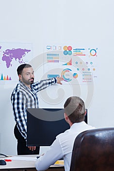 A neat and stylish office worker analyzes the schedule.