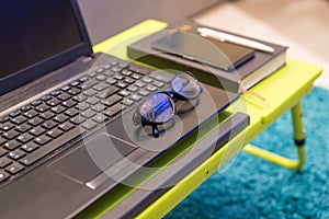 Neat tabletop workstation with eyeglasses