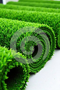 Neatly arranged turf rolls ready for installation, grassinstallation, landscape, rolls