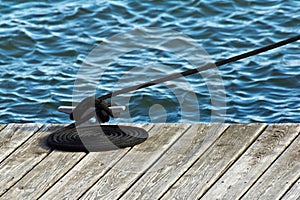 Neatly Coiled Rope on Boat Dock