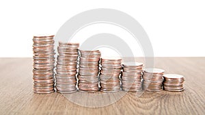 Neatly declining dollar coins on table
