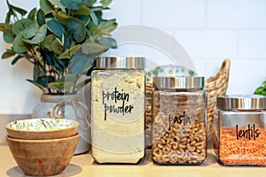 Neatly labeled glass canister food storage for the pantry