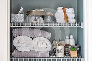 Neatly organized bathroom linen closet