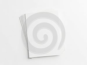 Stack of blank white paper sheets on a plain surface isolated on white background