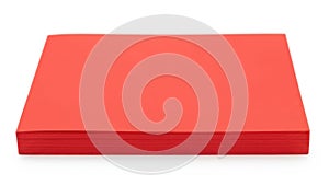 Stack of vibrant red construction paper sheets isolated on white background