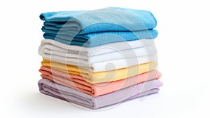 A neatly stacked pile of colorful towels in blue, white, yellow, orange, and purple on a white background