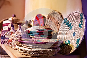 Neatly woven colourful baskets made of date palm leaves